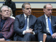 Hunter Biden, President Joe Biden&rsquo;s son, center, accompanied by his attorney Abbe Lowell, right, sit in the front row at a House Oversight Committee hearing as Republicans are taking the first step toward holding him in contempt of Congress, Wednesday, Jan. 10, 2024, on Capitol Hill in Washington.