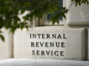 FILE - A sign outside the Internal Revenue Service building is seen, May 4, 2021, in Washington. As tax filing season officially starts Monday, Jan. 29, 2024, a limited number of taxpayers in 12 states will soon be eligible for a program that will allow them to calculate and submit their returns directly to the IRS without having to pay for commercial tax preparation software. The Direct File pilot program is set to be rolled out in phases.