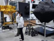 Staff of Japan Aerospace Exploration Agency (JAXA) prepare to watch a live streaming of the pinpoint moon landing operation by the Smart Lander for Investigating Moon (SLIM) spacecraft at JAXA&rsquo;s Sagamihara Campus Friday, Jan. 19, 2024, in Sagamihara near Tokyo.