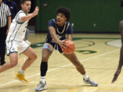 Seton Catholic’s Kaiden Wilson looks to pass to a teammate during a non-league boys basketball game against Evergreen on Tuesday, Dec. 5, 2023, at Evergreen High School.