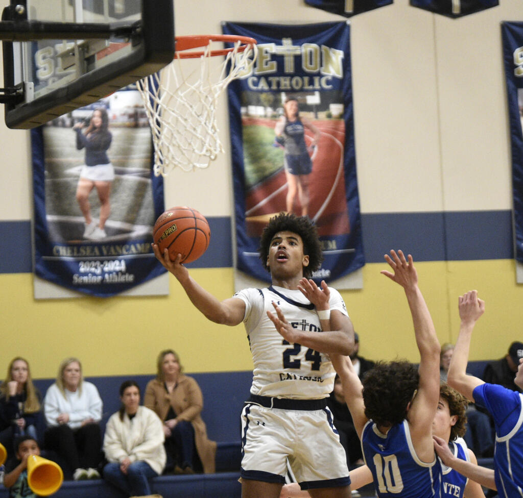 Seton Catholic freshman Kaiden Wilson drives to the basket against La Center during a boys basketball game at Seton Catholic College Prep on Tuesday, Jan. 23, 2024.