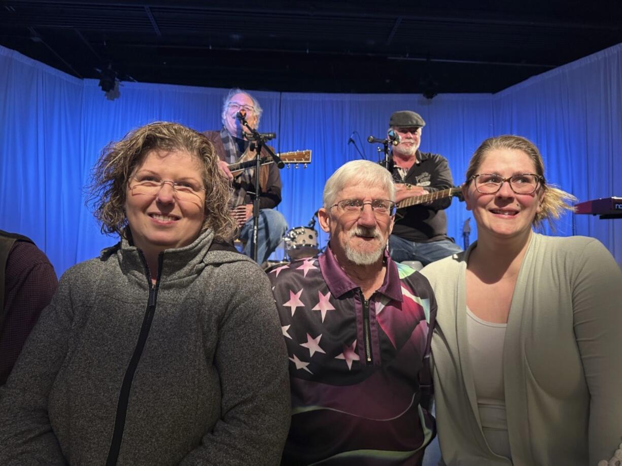 From left, Kathy Lebel, Tom Giberti and Samantha Juray, attend a benefit concert in Lewiston, Maine on Jan. 6, 2024. Immediately after Maine&rsquo;s deadliest mass shooting, the owners of the bowling alley and the bar in Lewiston where the gunman killed a total of 18 people were certain their doors were closed for good. Yet as time passed, they came to the same conclusion: They had to reopen.