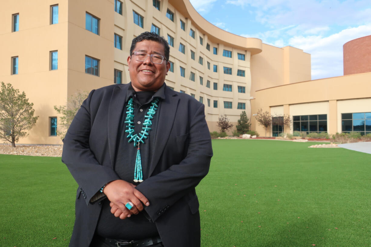 FILE - Dineh Benally poses for a photograph before a Navajo Nation presidential forum at a tribal casino outside Flagstaff, Ariz., Tuesday, June 21, 2022. Authorities on the largest Native American reservation in the U.S. have charged Dineh Benally and Farley BlueEyes, two tribal members with illegally growing marijuana on the Navajo Nation, marking just the latest development in a years-long case that also has involved allegations of forced labor, Thursday, Jan. 4, 2024.