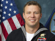 FILE - This photo provided by the Department of Defense shows Navy Special Warfare Operator 1st Class Christopher J. Chambers. Chambers is one of the two SEALs who were lost at sea during a raid on a boat carrying illicit Iranian-made weapons to Yemen.