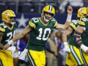 Green Bay Packers quarterback Jordan Love (10) reacts after throwing a touchdown pass against the Dallas Cowboys during the second half of an NFL football game, Sunday, Jan. 14, 2024, in Arlington, Texas.