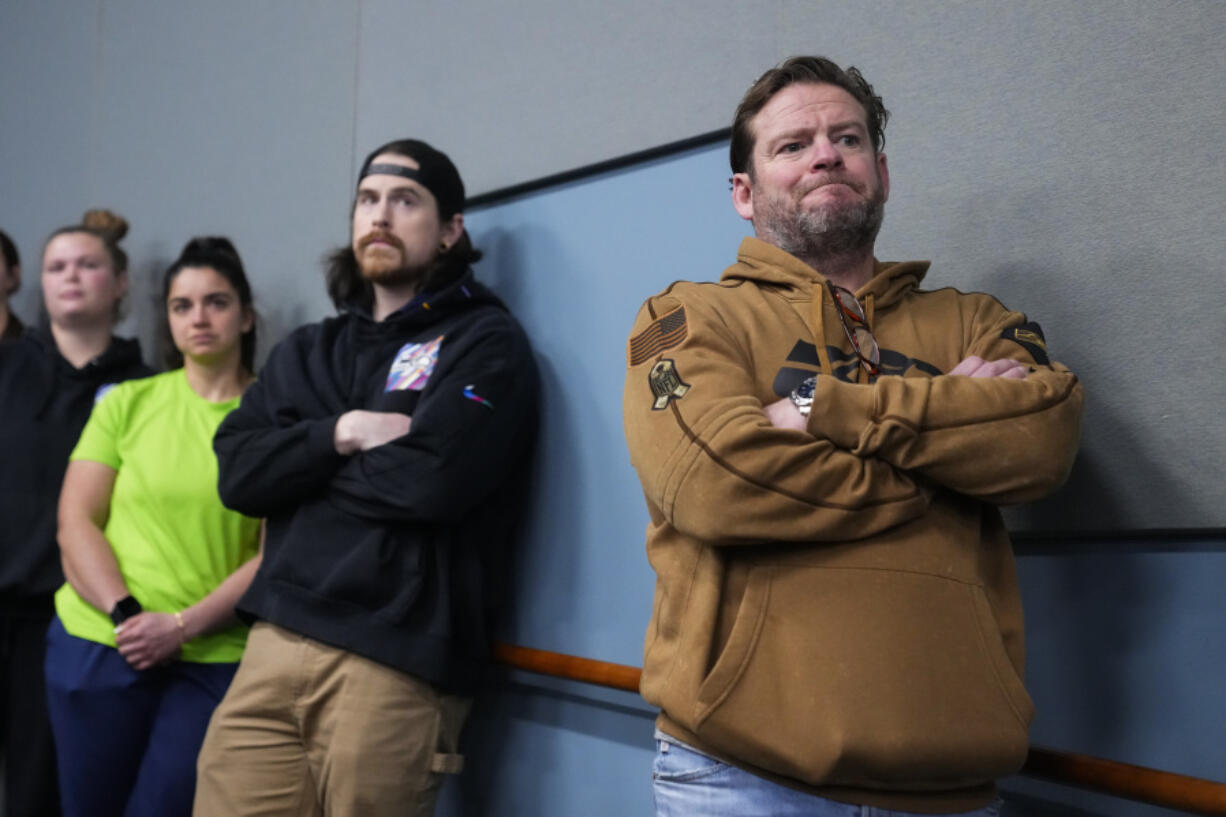 Seattle Seahawks general manager John Schneider listens as head coach Pete Carroll speaks during a media availability after it was announced he will not return as head coach next season, Wednesday, Jan. 10, 2024, at the NFL football team&rsquo;s headquarters in Renton, Wash. Carroll will remain with the organization as an advisor.