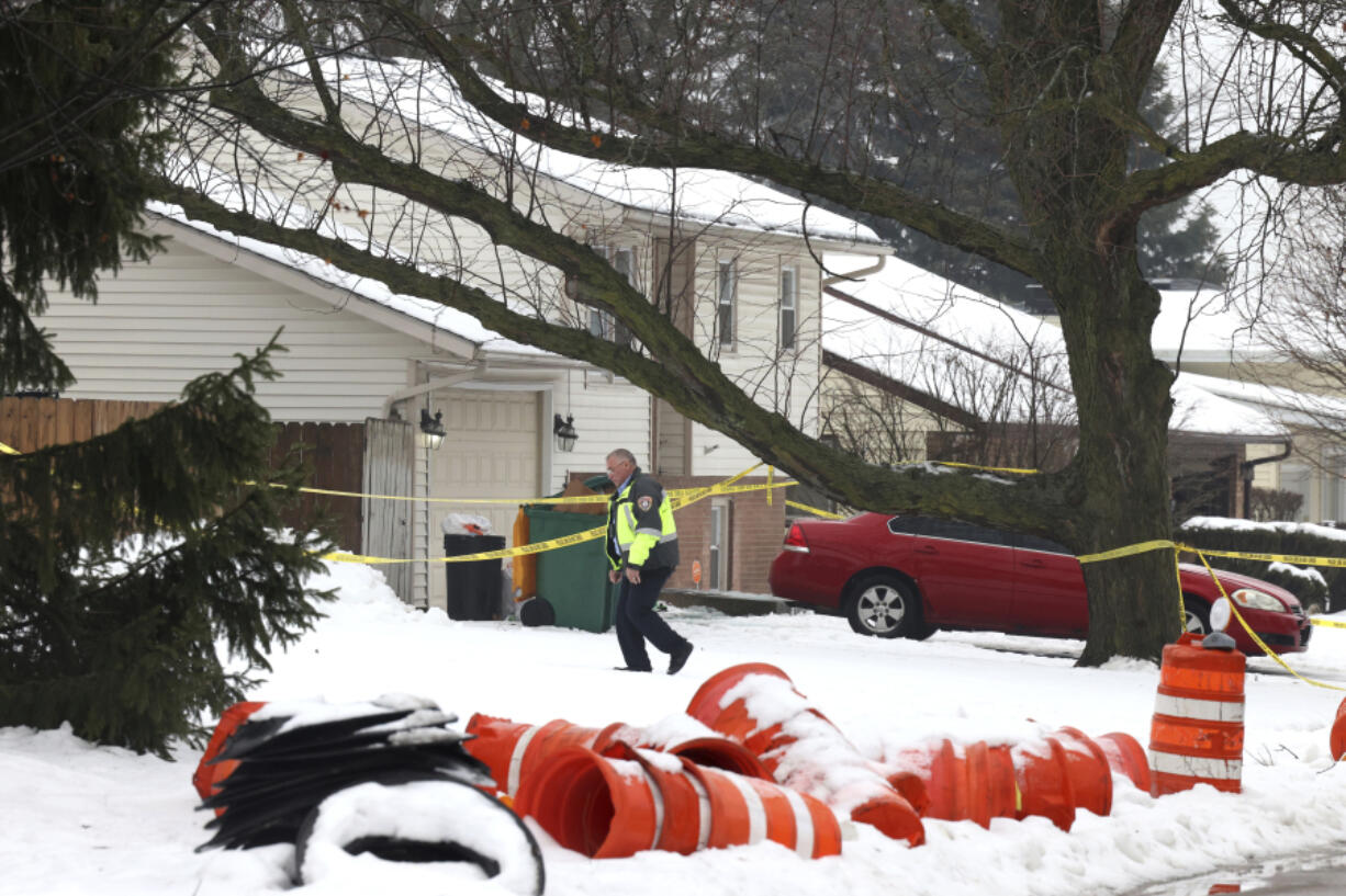 Romeo Nance, Suspect in shootings, antonio perez/Chicago Tribune, A Joliet, Ill.,  police officer surveys a crime scene Tuesday where a man is suspected of shooting and killing multiple people Sunday in suburban Chicago.