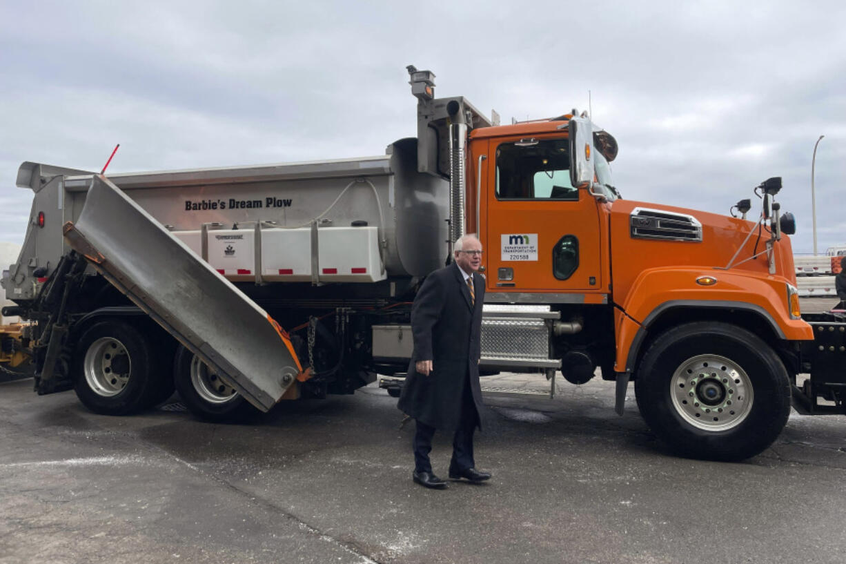 Minnesota Gov. Tim Walz smiles after a ride in a snowplow named &ldquo;Barbie&rsquo;s Dream Plow&rdquo;, Tuesday, Jan. 30, 2024, in Richfield, Minn. Barbie&rsquo;s Dream Plow was one of eight winning names in Minnesota&rsquo;s fourth annual Name a Snowplow contest.