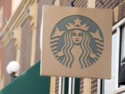 Starbucks sign hangs outside a casino along Main Street Wednesday, Sept. 20, 2023, in Deadwood, S.D. A consumer advocacy group filed a lawsuit against Starbucks on Wednesday, Jan.