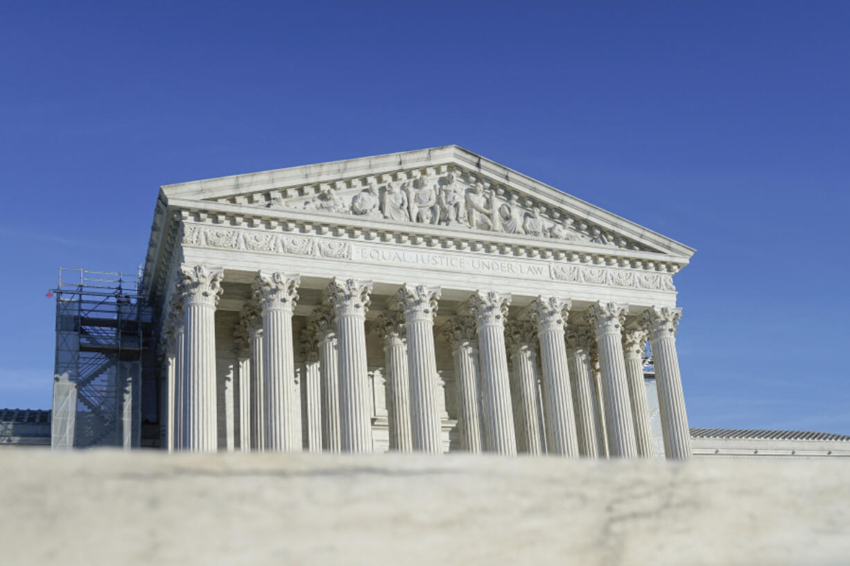 The U.S Supreme Court is photographed on Friday, Jan. 5, 2024, in Washington. The Supreme Court is allowing Idaho to enforce its strict abortion ban, even in medical emergencies, while a legal fight continues. The justices on Jan. 5, said they would hear arguments in the case in April and put on hold a lower court ruling that had blocked the Idaho law in hospital emergencies, based on a lawsuit filed by the Biden administration.