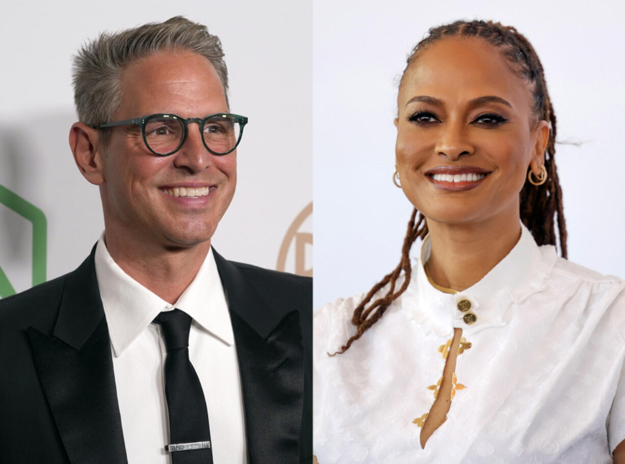 This combination of photos shows Greg Berlanti at the 33rd annual Producers Guild Awards in Los Angeles on March 19, 2022, left, and director Ava Duvernay at the photo call for the film &ldquo;Origin&rdquo; during the 80th edition of the Venice Film Festival in Venice, Italy, on Sept. 6. Berlanti and Duvernay are included on a list that scores them for the diversity and inclusion of the people working both on screen and behind the scenes.