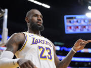 Los Angeles Lakers forward LeBron James gestures after scoring during the first half of an NBA basketball game against the Portland Trail Blazers Sunday, Jan. 21, 2024, in Los Angeles. (AP Photo/Mark J.