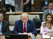 FILE - Former President Donald Trump, center, sits at the defense table with his attorney&#039;s Christopher Kise, left, and Alina Habba, at New York Supreme Court, Dec. 7, 2023, in New York. Testy encounters between lawyers for former President Donald Trump and judges have come to be expected as the attorneys carry into the courtroom the bombastic, and often antagonistic, style that defines his campaign trail demeanor.