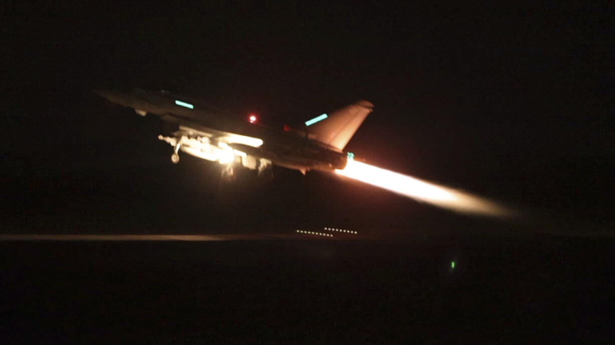 In this image provided by the UK Ministry of Defence taken on Thursday Jan. 11, 2024  shows an RAF Typhoon aircraft taking off from RAF Akrotiri in Cyprus, for a mission to strike targets in Yemen. The U.S. and British militaries bombed more than a dozen sites used by the Iranian-backed Houthis in Yemen late on Thursday, in a massive retaliatory strike using warship- and submarine-launched Tomahawk missiles and fighter jets, U.S. officials said.