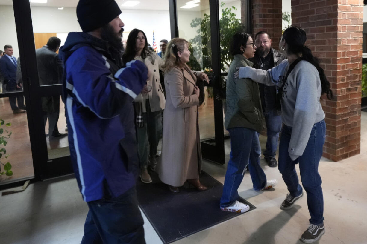 Family members and others affected by the Robb Elementary shooting leave a meeting where Attorney General Merrick Garland shared a report on the findings of an investigation into the 2022 school shooting, Wednesday, Jan. 17, 2024, in Uvalde, Texas.