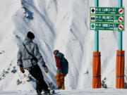 Two snowboarders head down the R-3 course as they cross into Hakuba 47 from Hakuba Goryu on Feb. 6, 2023, in Hakuba, Japan. Many of the resorts in the Hakuba Valley are connected and can be ridden on the same lift ticket.