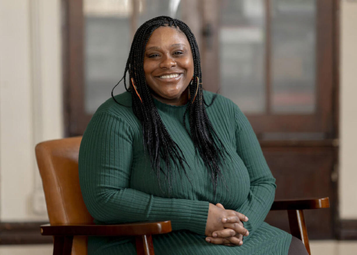 Rokea Jones, who is a doula and community engagement specialist with Open Arms Perinatal Services, sits Tuesday in the organization&rsquo;s offices at El Centro de la Raza in Seattle. Washington is a hotspot for birth workers, while state and corporate policies are starting to reflect that.