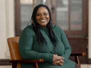 Rokea Jones, who is a doula and community engagement specialist with Open Arms Perinatal Services, sits Tuesday in the organization&rsquo;s offices at El Centro de la Raza in Seattle. Washington is a hotspot for birth workers, while state and corporate policies are starting to reflect that.