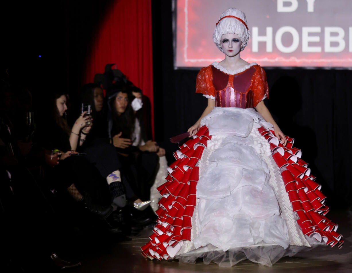 A model shows off a design by Patched by Phoebe on Jan. 20 during the ShadowBall fashion show hosted by Triveni Institute at Macy&rsquo;s on State Street in downtown Chicago. Outfits by the runway models featured designs using single-use plastic products or things that others would consider trash or obsolete.