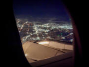 The lights of Dallas are seen Feb. 3 from a flight on approach for DFW Airport. (Photos by Smiley N.