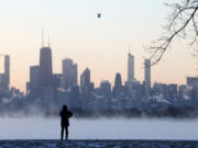 The sunrise shines Jan. 16 over the Chicago skyline and the steaming frigid waters of Lake Michigan at Montrose Beach. Voters in Chicago will weigh the mayor&rsquo;s plan to triple the current real estate transfer tax on residential and commercial property sales between $1 million and $1.5 million and quadruple the tax for properties above $1.5 million to fund homelessness services.