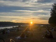 The sun sets over Mock’s Crest viewpoint in Portland. An Oregon bill would lead to earlier sunsets in the summer.