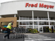 Ben Lemons puts carts away at the Fred Meyer in Battle Ground in 2019.