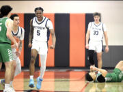 Skyview's Demaree Collins (5) after grabbing a steal and drawing a foul against Woodinville in the closing seconds of a Class 4A State Opening Round boys basketball game on Saturday, Feb. 24, 2024, at Battle Ground High School.