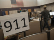 Dispatchers answer 911 calls at Clark Regional Emergency Services Agency in Vancouver on Nov. 17, 2015.  Officials at the dispatch center encourage more people to sign up for public alerts for information about fire evacuations, missing people, law enforcement activity, natural gas leaks and more. Out of Clark County&rsquo;s more than 510,000 residents, only about 33,000 are signed up for public alerts.