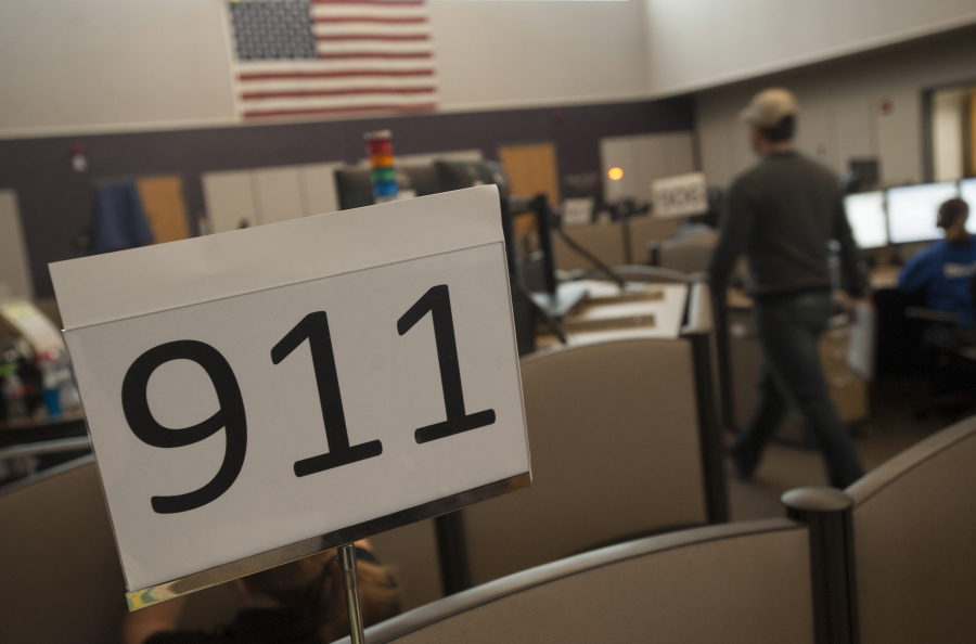 Dispatchers answer 911 calls at Clark Regional Emergency Services Agency in Vancouver on Nov. 17, 2015.  Officials at the dispatch center encourage more people to sign up for public alerts for information about fire evacuations, missing people, law enforcement activity, natural gas leaks and more. Out of Clark County&rsquo;s more than 510,000 residents, only about 33,000 are signed up for public alerts.