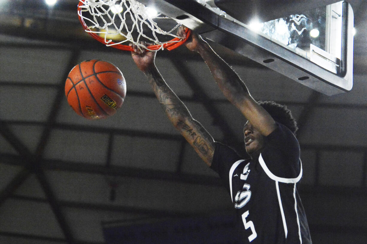 Skyview's Demaree Collins finishes a dunk during the first quarter of the Storm's 75-69 loss to Davis in Thursday's 4A quarterfinal game.