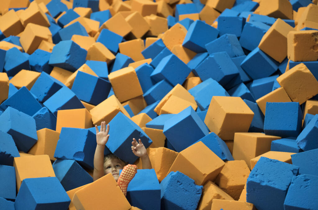 A child plays in the foam pit at SkyZone in Vancouver in  2017.