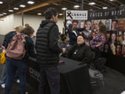 Kenneth Otten, center, a community liaison with XChange Recovery Services, greets guests at an educational night for families and residents impacted by substance use at Living Hope Church.