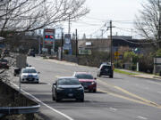 Traffic travels north Feb. 22 along a stretch of Highway 99 without sidewalks in Hazel Dell. Clark County Public Works will host an open house at 6 p.m. today about a project to add sidewalks to the north end of Highway 99.