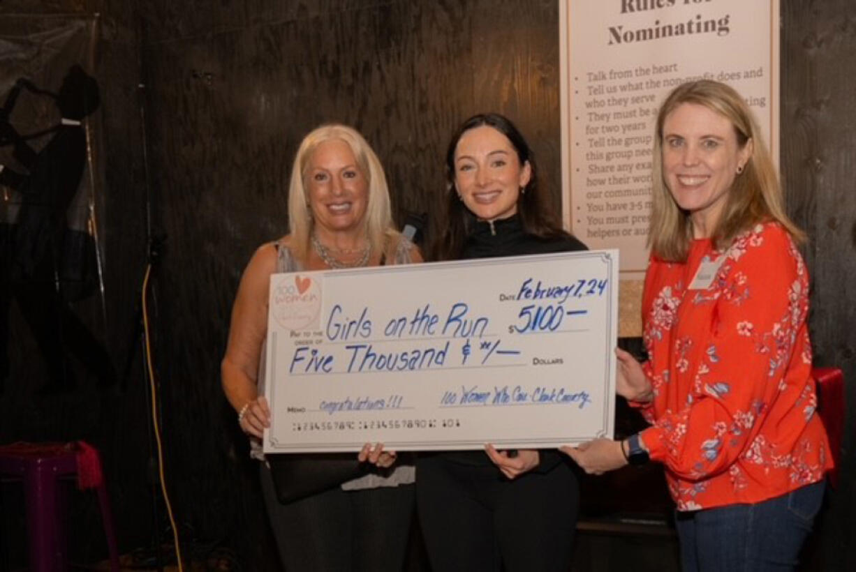 100 Women Who Care Clark County recently presented $5,100 to Girls on the Run Greater Oregon.