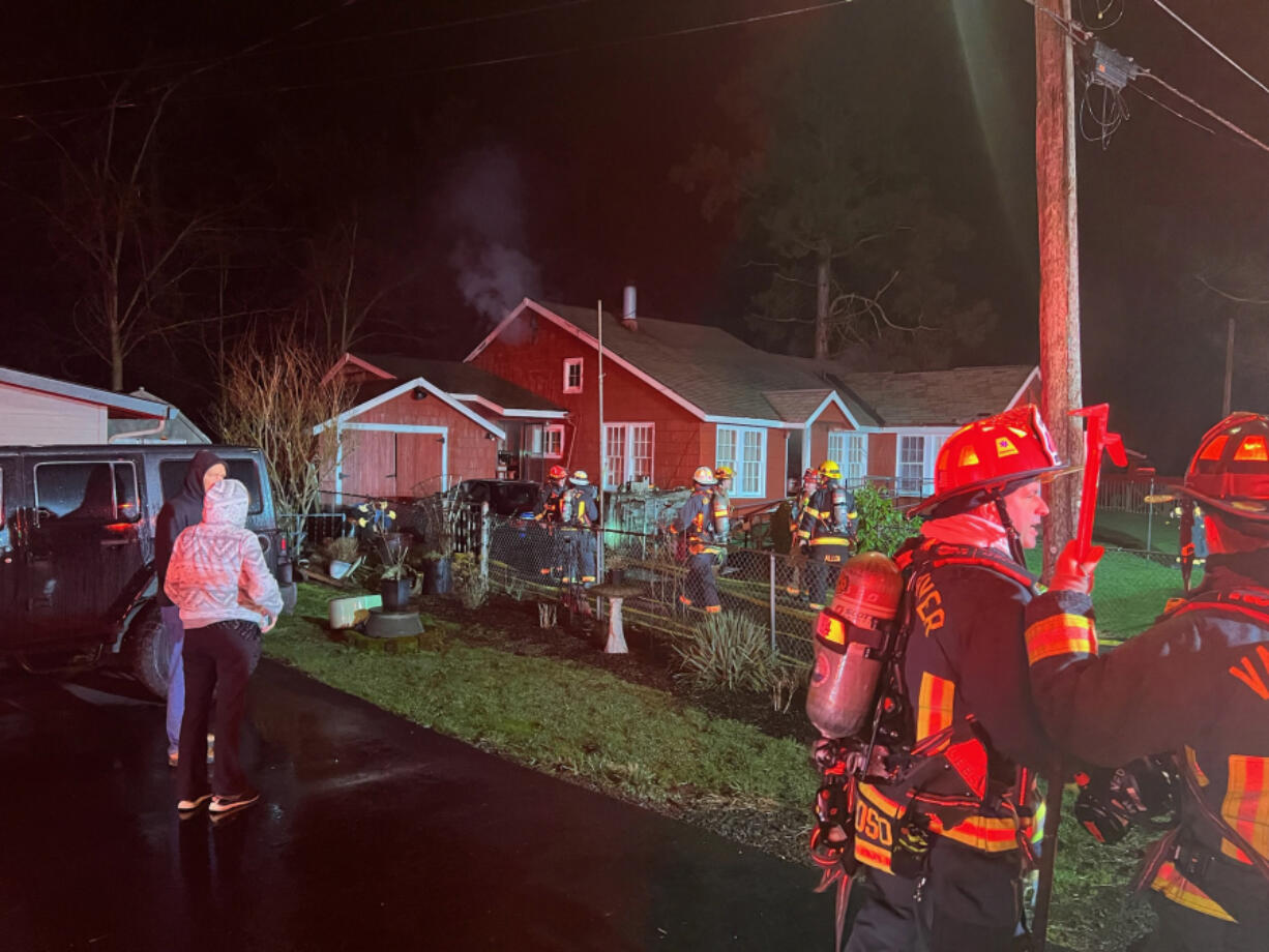 Firefighters rescued a disabled man from a burning house early Tuesday morning in Washougal, according to East County Fire and Rescue.