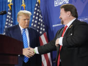 FILE - Nevada GOP chair Michael McDonald, right, shakes hands with Republican presidential candidate former President Donald Trump at a campaign event, Jan. 27, 2024, in Las Vegas.