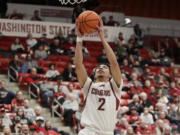 Washington State guard Myles Rice drives to the basket during the first half of the team's NCAA college basketball game against California, Thursday, Feb. 15, 2024, in Pullman, Wash.