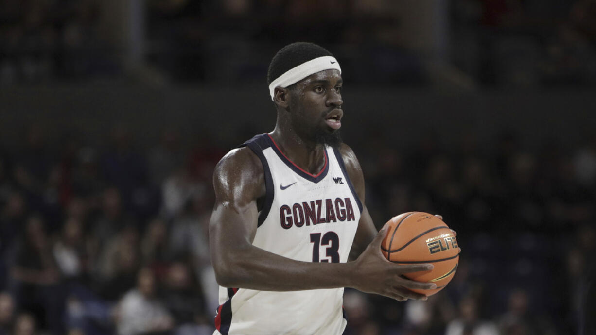 Gonzaga forward Graham Ike controls the ball during the second half of an NCAA college basketball game against Pacific, Saturday, Feb. 17, 2024, in Spokane, Wash.