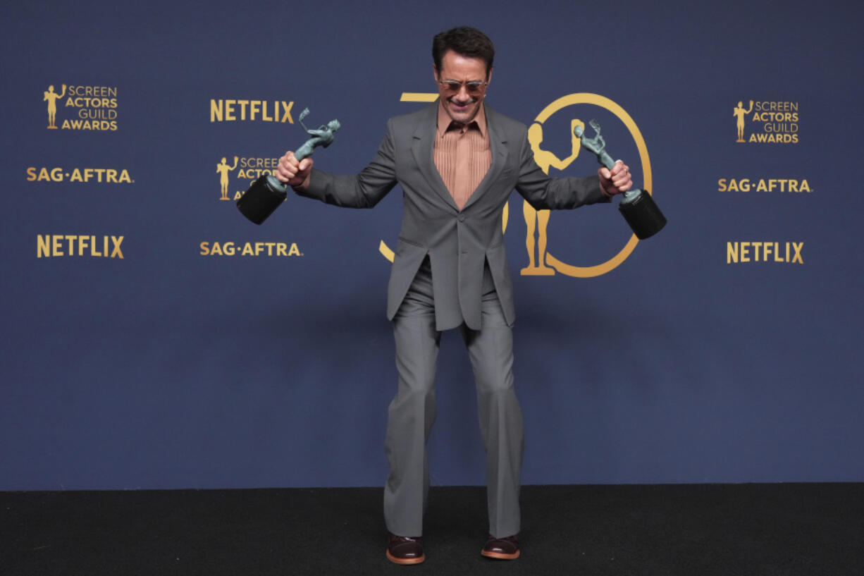 Robert Downey Jr., winner of the awards for outstanding performance by a male actor in a supporting role and outstanding performance by a cast in a motion picture for &ldquo;Oppenheimer&rdquo; poses in the press room during the 30th annual Screen Actors Guild Awards on Saturday, Feb. 24, 2024, at the Shrine Auditorium in Los Angeles.