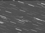 This image provided by Virtual Telescope Project out of Italy shows a single 180-second exposure asteroid that was approaching Earth, about 4 million kilometers, Thursday, Jan. 31, 2024.  Astronomers say an asteroid as big as a skyscraper will pass within 1.7 million miles of Earth on Friday. There&#039;s no chance of it hitting us since it will pass seven times the distance from Earth to the moon.