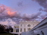 The White House is seen at sunset in Washington, Friday, Jan. 26, 2024.