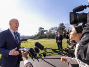 President Joe Biden speaks to members of the media as he arrives at the White House in Washington, Monday, Feb. 19, 2024, after returning from Rehoboth Beach, Del.