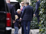 President Joe Biden, center, talks to his grandson Beau, left, as son Hunter Biden, right, looks on after dining at The Ivy in Los Angeles, Sunday, Feb. 4, 2024. Today is Hunter Biden&rsquo;s birthday.