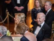 President Joe Biden and first lady Jill Biden laugh during a reception for members of the National Governors Association and their spouses in the East Room of the White House in Washington, Saturday, Feb. 24, 2024.