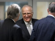 Rep. Andy Biggs, R-Ariz., left, and Republican staff attorney Steve Castor, right, speak with James Biden, center, the brother of President Joe Biden, during a break of a private interview with House Republicans at Thomas P. O&rsquo;Neill House Office Building on Capitol Hill in Washington, Wednesday, Feb. 21, 2024.