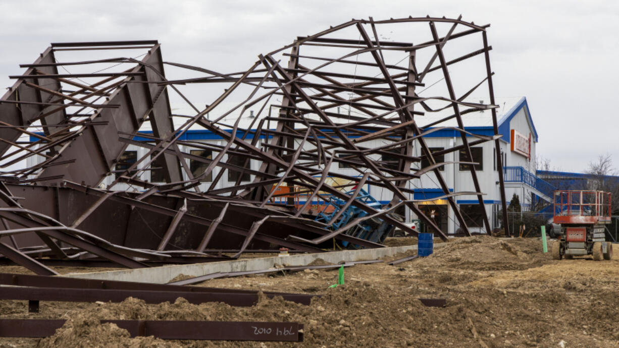 Twisted girders and debris cover the ground from a deadly structure collapse at a construction site near the Boise Airport on Thursday, Feb. 1, 2024 in Boise, Idaho.  Authorities responded Wednesday to the privately owned steel-framed hangar, which suffered a &ldquo;catastrophic&rdquo; collapse, Boise Fire Department Operations Chief Aaron Hummel said during an earlier news briefing.