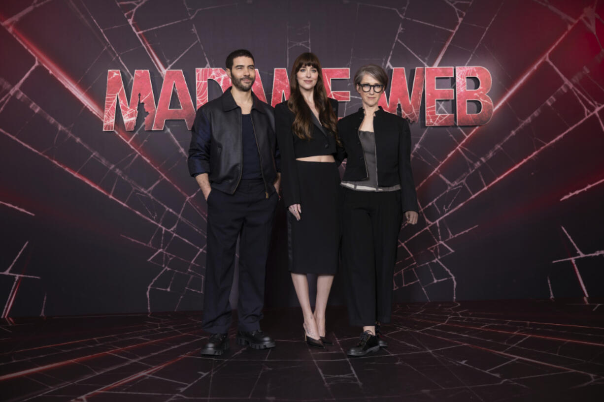 Tahar Rahim, from left, Dakota Johnson and director S.J. Clarkson attend a photo call Jan. 31 for the film &ldquo;Madame Web&rdquo; in London.