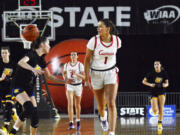 Reagan Jamison (1) makes a behind-the-back pass on a breakaway to Riley Sanz during the first half of Camas' 64-23 win over Tahoma in Thursday's quarterfinal. Camas had 18 assists on 24 field goals.