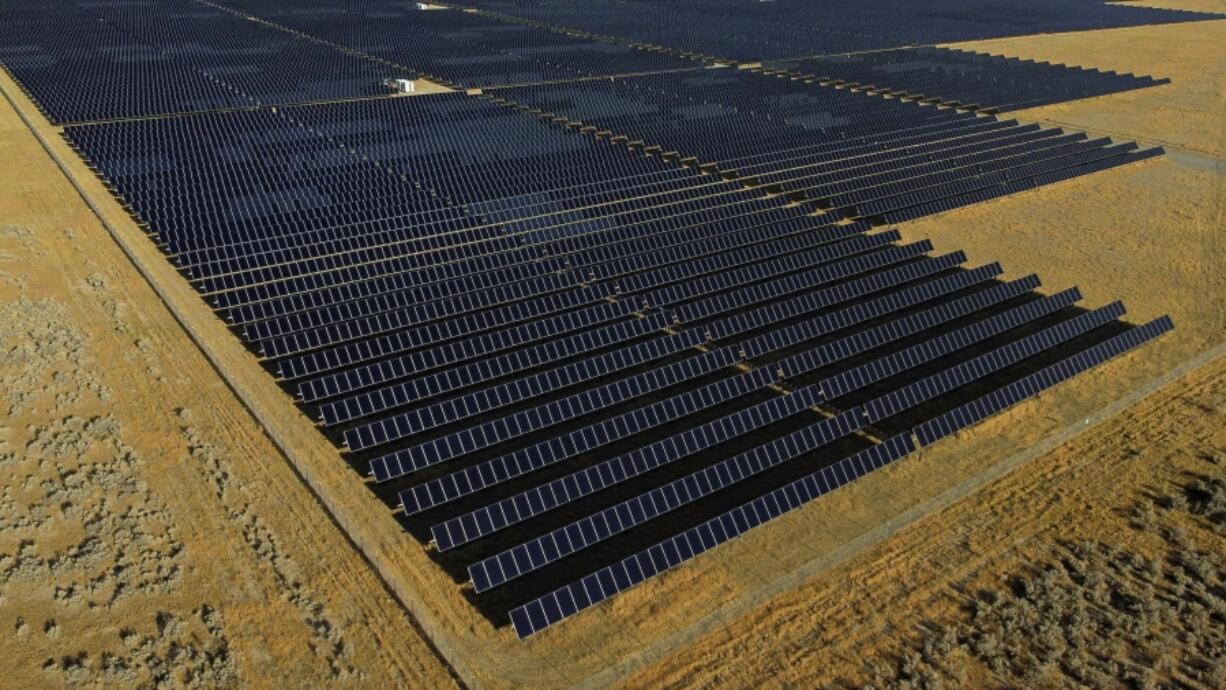 FILE - A solar farm sits in Mona, Utah, Aug. 9, 2022. On Tuesday, Feb. 27, 2024, the Biden administration will announce 17 projects across the U.S. to expand renewable energy access in rural areas, particularly for Native American tribes. The projects, which will cost $366 million, are funded by a $1 trillion infrastructure law President Joe Biden signed in 2021.